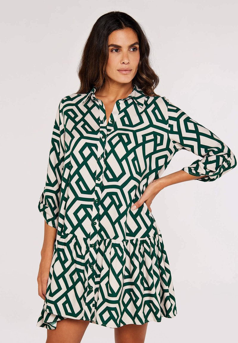 Grünes und cremefarbenes gemustertes Hemdblusenkleid mit gestuften Saum, langen Ärmeln und entspannter Passform. V-Ausschnitt und Taschendetails sind ebenfalls enthalten.