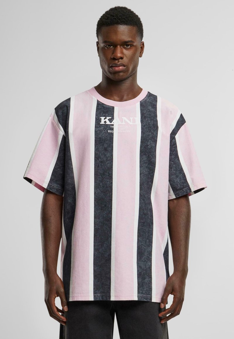 Striped t-shirt in pink and dark blue with short sleeves. Features a crew neckline and prominent white logo print on the chest.