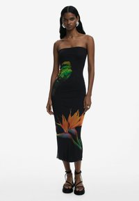 Black, strapless midi dress with a fitted design. Features a colorful bird and tropical flower graphic on the skirt. Textured stretch fabric.