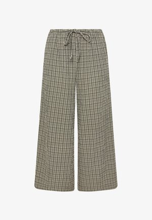 Weite Hosen aus einem karierter Stoff in Schwarz und Creme, ausgestattet mit einem elastischen Bund und einem Kordelzug zur Anpassung.