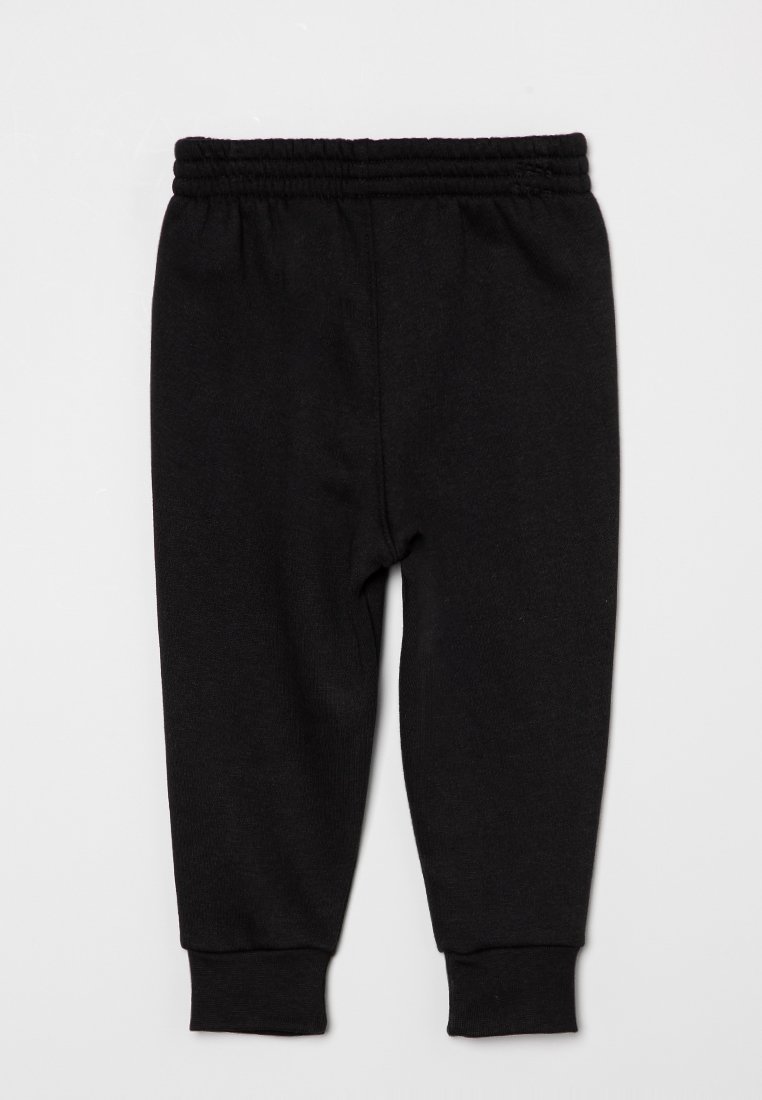 Pantaloni jogger neri in cotone con vita elasticizzata, polsini affusolati e una texture morbida. Design minimalista senza alcun motivo visibile.