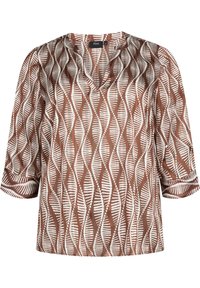 Blusa a maniche 3/4 con motivo marrone e bianco, scollo a V e righe verticali ondulate con dettagli a pois e a righe.
