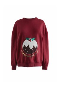 Bordeauxkleurige sweatshirt met een feestelijk puddingsontwerp, voorzien van witte glazuur, groene hulst en rode accenten, met de tekst "Een Kleine Bundel van Blijdschap".