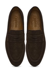 Dark brown suede loafers with a stitched edge and a small cutout accent on the upper. Soft leather innersole for comfort.