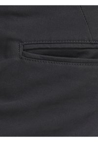 Black fabric with a horizontal slit pocket featuring close, neat stitching along the edges.