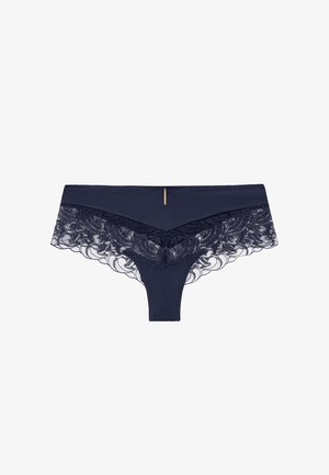 Lingerie bleu marine avec un devant en tissu lisse et des détails en dentelle délicate au dos, agrémentée d'un petit accent doré à la taille.