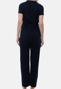 Mörkblå bomullströja och byxset, med rund halsringning och korta ärmar, i en avslappnad passform och med en mjuk textur.