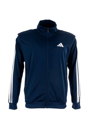 Marineblauwe sportjack met een hoge kraag, rits aan de voorkant en witte strepen op de mouwen. Bevat een adidas-logo aan de bovenlinkerzijde.