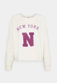 Felpa a maniche lunghe color crema con la scritta "NEW YORK COLLEGE" e una grande "N" in tessuto viola sulla parte frontale, collo a giro e polsini a coste.