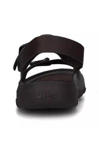 Sandal nero con due cinturini regolabili, una soletta testurizzata e una suola in gomma solida. Logo del marchio 'Jeep' impresso sul tallone.