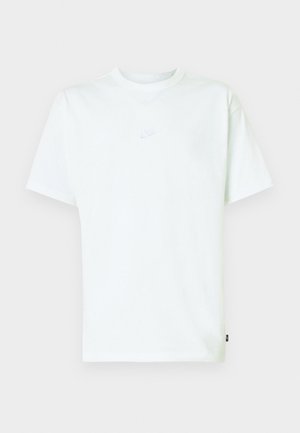 Wit katoenen T-shirt met een ronde hals, korte mouwen en een klein reliëf Nike-logo op de borst. Zachte textuur en een ontspannen pasvorm.