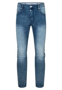 Slim-fit jeans in medium blue denim, featuring a classic five-pocket design, front button closure, and slight fading for texture.