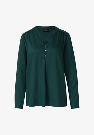 Bosgroene blouse met lange mouwen, een splitnek, drie knopen en geplooide details op de schouders. Glad materiaal met een relaxte pasvorm.