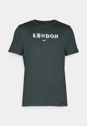 Dark green cotton t-shirt featuring "LONDON" text and a lion graphic, with a Nike logo. Short sleeves and crew neck design.