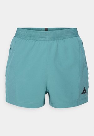 Teal atletisk shorts med en tekstureret talje, sidelommer og sort Adidas-logo nederst til højre. Letvægtsstof.