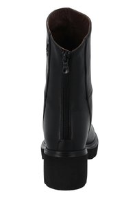 Bottine en cuir noir avec fermeture éclair à l'arrière, bout rond et semelle épaisse vue de l'arrière.
