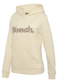 Beige Kapuzenpullover aus Baumwollmischung; verfügt über eine Fronttasche, gerippte Bündchen und ein großes "Bench."-Logo in einem dunkleren Farbton.