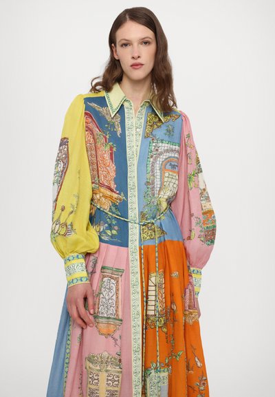 Colorful long dress featuring blue, yellow, pink, and orange sections, intricate patterns, and a button-down collar with puffed sleeves.
