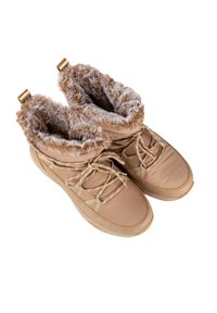 Stivali alla caviglia beige con fodera in pelliccia, materiale sintetico, colletto imbottito e design con lacci. Presentano anelli in metallo dorato per una facile vestibilità.