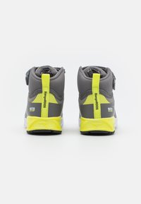 Gray water-resistant shoes with yellow accents, featuring a padded collar, adjustable strap, and textured rubber soles for grip.