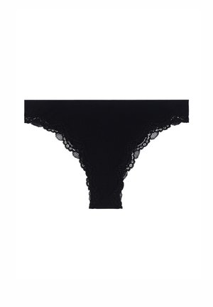 Zwarte thong met kant, voorzien van een zacht katoenen lichaam met golvende randen en een soepele tailleband.