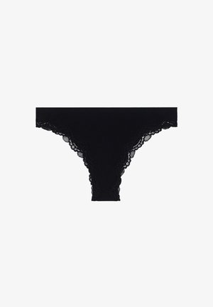 Black lace-trimmed thong featuring a soft cotton body with scalloped edges and a smooth waistband.