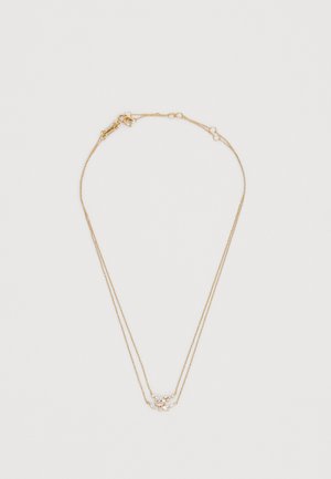 Collana a strati color oro con due catene sottili e un delicato elemento decorativo con piccole pietre brillanti.