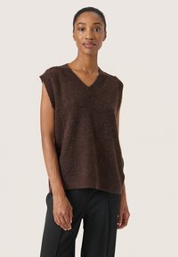 Top fără mâneci din lână brună, cu decolteu �în V, având o croială lejeră și tiv cu nervuri. Textură netedă, aspect moale și design ușor.