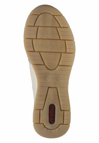 Lightweight tan rubber sole with a textured surface, featuring a central logo and patterned grooves for traction and grip.