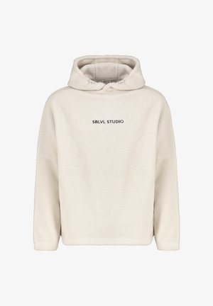Cream-colored fleece hoodie with a relaxed fit. Features a drawstring hood and the text "SBLVL STUDIO" in black on the front.
