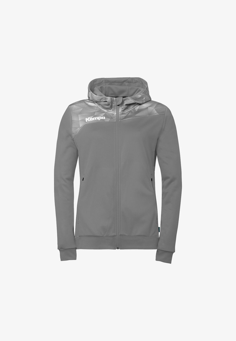 Veste à capuche grise à fermeture éclair avec un motif géométrique sur les épaules et le logo "Kempa" sur le côté gauche de la poitrine.