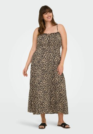 Robe maxi imprimée léopard avec des bretelles fines, un corsage froncé et un tissu fluide. Présente un fond beige avec des taches noires et une coupe décontractée.