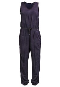 Fioletowy kombinezon w wzór houndstooth z bezrękawowym fasonem, regulowanym paskiem w talii oraz dwiema bocznymi kieszeniami. Miękka tkanina o luźnym kroju.