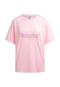 Pink short-sleeve T-shirt with rolled cuffs and text "SOCCX & SHINE Creating Stories" on front in mixed fonts and styles.