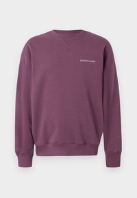 Purple sweatshirt made from soft fabric, featuring a crew neckline and ribbed cuffs. Small white "Lyle & Scott" logo on the chest.