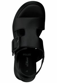 Black sandal with a wide strap, buckle closure, and open toe design. Soft foam insole for comfort. Flat outsole with minimal texture.