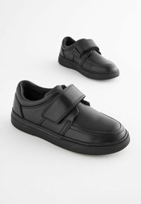 Pair of black leather casual shoes with wide Velcro straps on a white background.