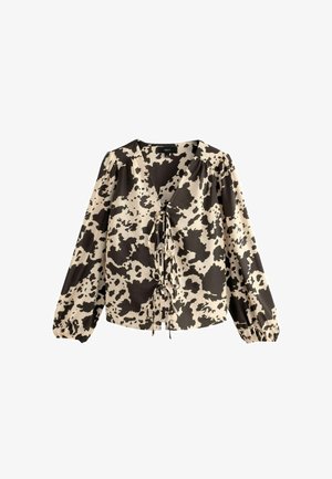 Blusa a maniche lunghe con scollatura a V, caratterizzata da una stampa a macchie di mucca in crema e nero, maniche arricciate e un dettaglio con fiocco sulla parte anteriore.