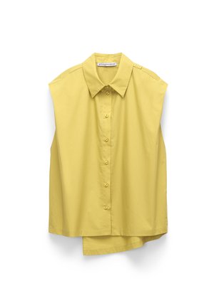 Sleeveless yellow button-up shirt with a pointed collar and slight asymmetrical hem, hanging against a white background.