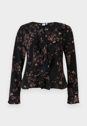 Blouse noire à manches longues avec motif floral marron, col en V à volants et détail à nouer à l'avant, en tissu léger.