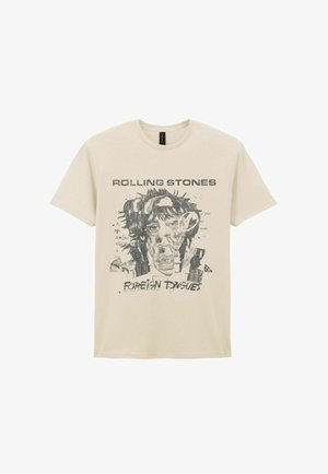T-shirt beige con grafica nera di un volto distorto, testo "ROLLING STONES" sopra e "FOREIGN TONGUES" sotto l'immagine.