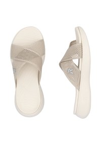 Beige slide sandals featuring a textured cross-strap design, made of breathable material, with a white outsole and logo detail.