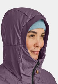 Purple insulated jacket with a fitted hood, featuring a zipper closure and textured fabric. The inner lining is a soft blue.