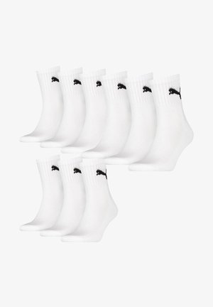 White cotton ankle socks, featuring a black logo on the cuff, with ribbed texture. Set of ten pairs arranged in a stacked position.
