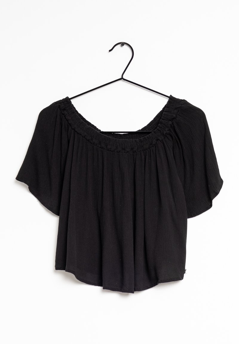 Haut noir décolleté suspendu à un crochet noir. Présente un col smocké et des manches courtes et amples. Fabriqué en tissu léger et texturé.