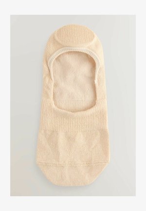 Chaussette beige à pied entier avec un bout arrondi et un design bas. Fabriquée en matériau doux et texturé, présentant des zones de renforcement au niveau des orteils et du talon.