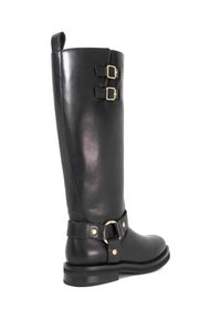 Black leather knee-high boot with a smooth texture, featuring two gold buckles on the shaft and a strap with a circular accent at the ankle.