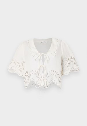 White cropped blouse with short sleeves, featuring a scalloped hem, floral cutouts, and a tie closure at the neckline. Made from lightweight fabric.