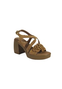 Brown suede block-heeled sandal with wide crisscross straps and a floral accent. Thick sole and adjustable ankle strap. Textured appearance.