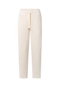 Pantalons de jogging beige clair en tissu doux, dotés d'une taille élastique avec cordon de serrage et de poches latérales. Design simple et décontracté.